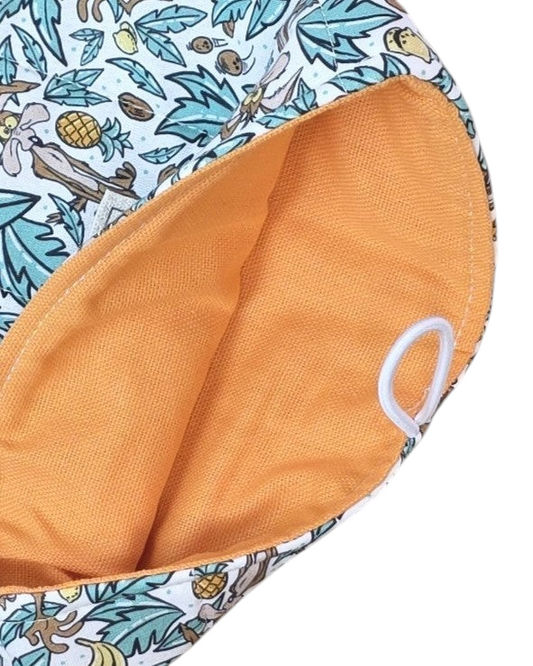 Funda artesanal SAVAGE LINE para libro o tablet con estampado de Looney Tunes, algodón acolchado y forro naranja.