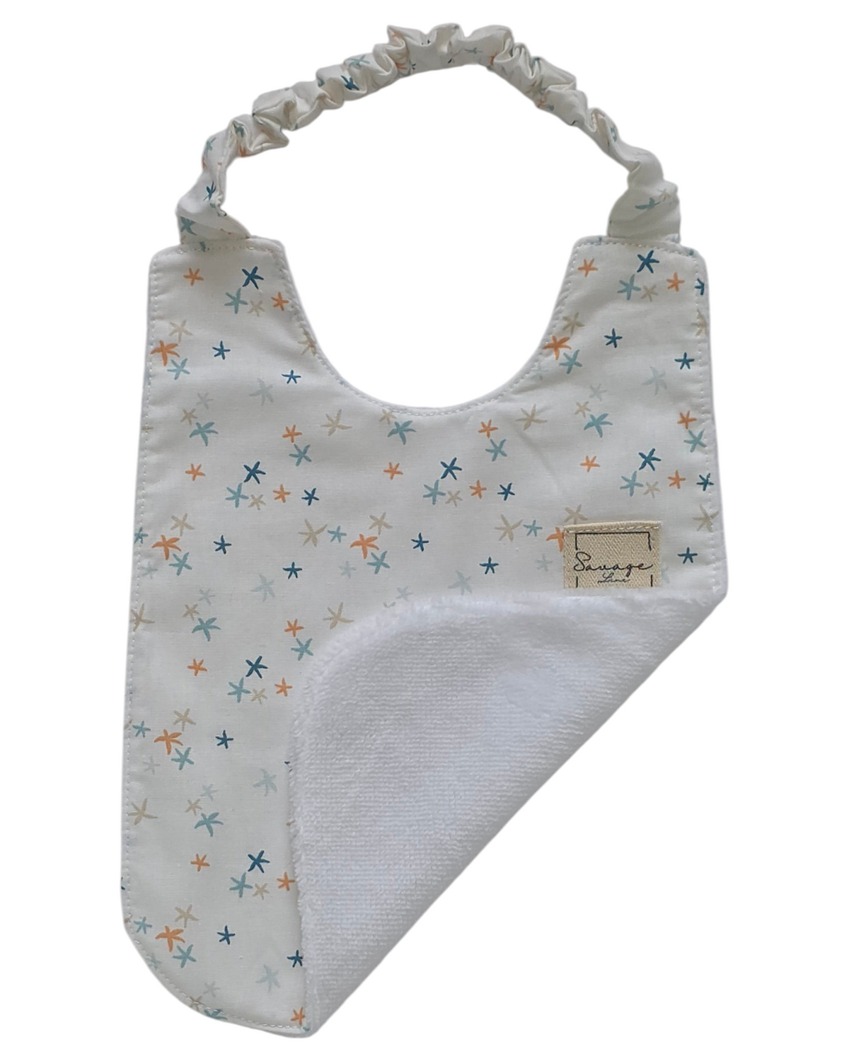 Babero Montessori SAVAGE LINE de algodón orgánico con estampado de estrellas de mar y reverso de rizo de bambú