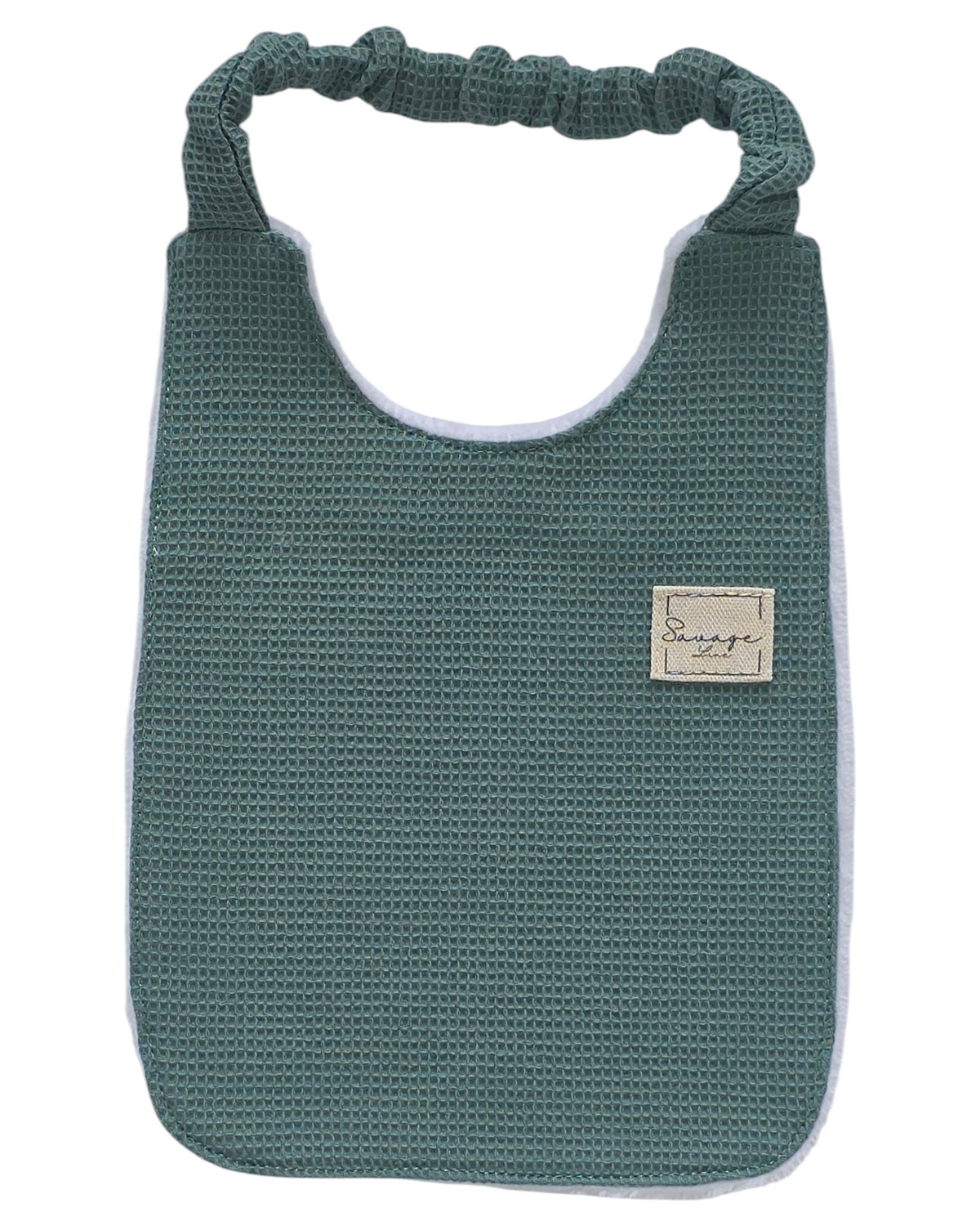 Babero Montessori SAVAGE LINE verde de algodón orgánico con textura waffle y elástico ajustable para bebé