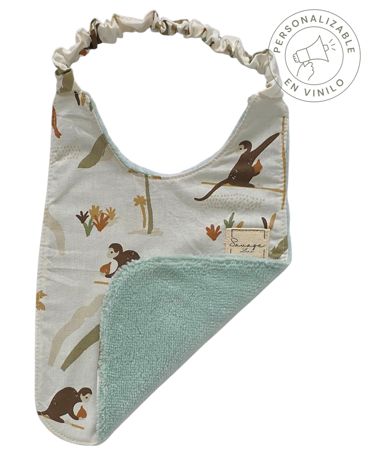 Babero Montessori SAVAGE LINE de algodón orgánico con estampado de jungla y reverso de rizo de bambú verde menta.