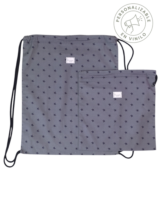 Dúo de mochila y bolsa multiusos SAVAGE LINE en algodón verde con estampado de estrellas negras y cierre de cordón.