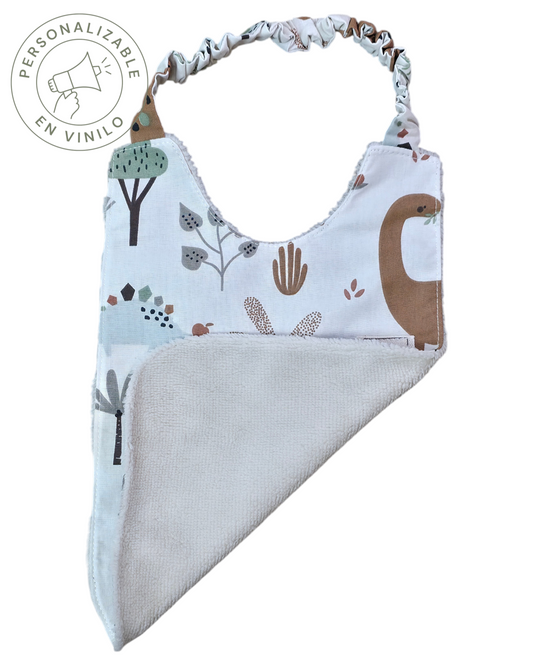 Babero Montessori SAVAGE LINE de algodón orgánico con estampado de dinosaurios y reverso de rizo de bambú suave.