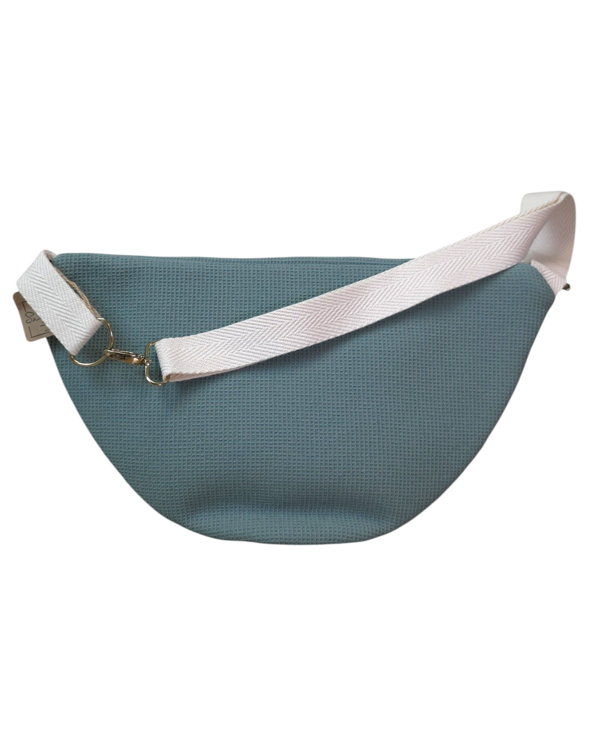 Riñonera artesanal SAVAGE LINE modelo Chloe en tejido waffle color verde azulado con correa ajustable de color crema