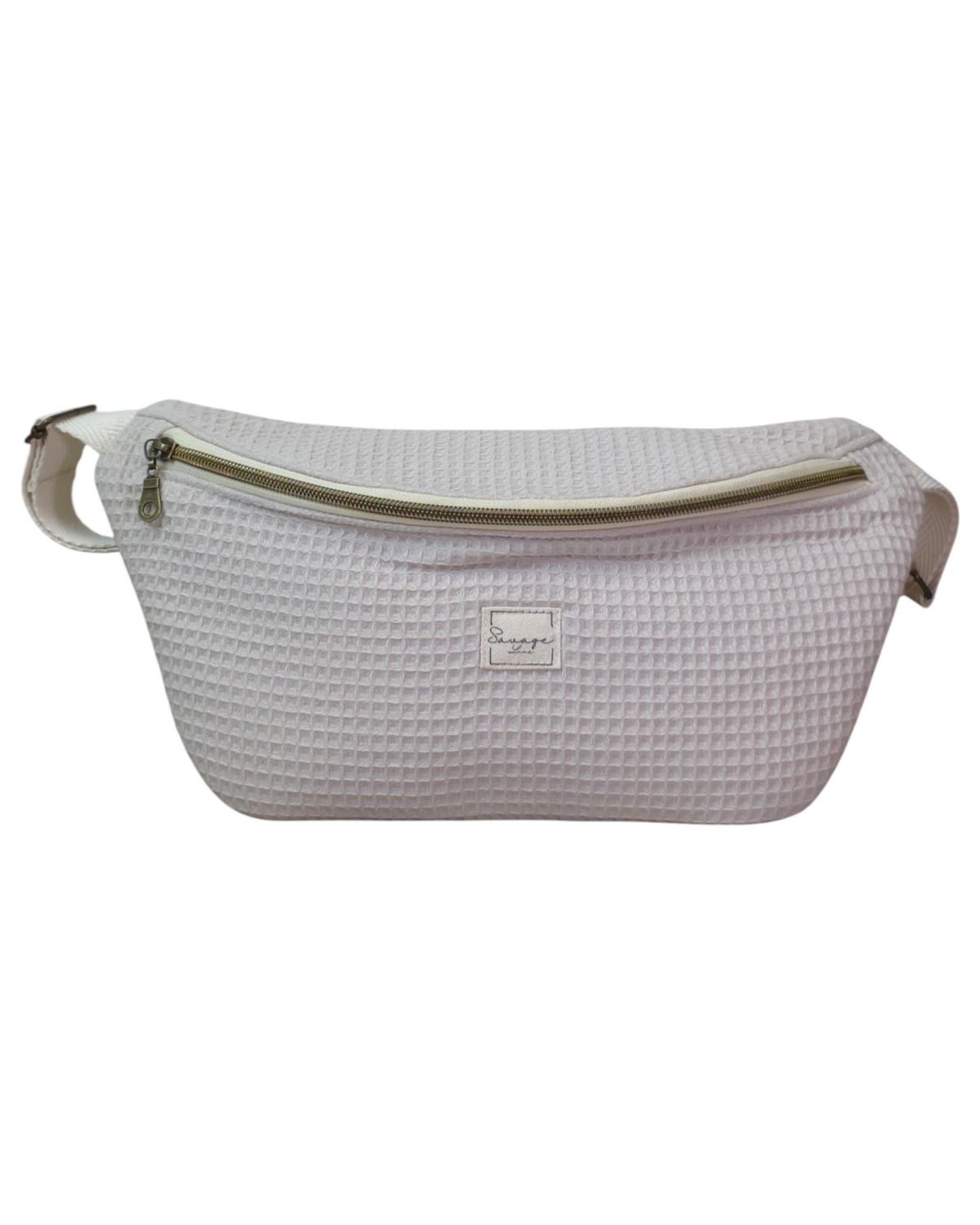 Riñonera artesanal SAVAGE LINE modelo Micka en tejido waffle color beige con cremallera y correa ajustable.
