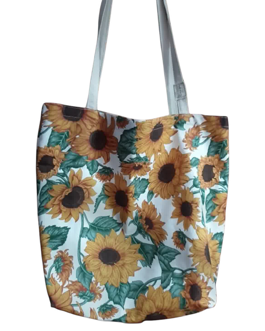 Tote bag artesanal SAVAGE LINE de loneta de algodón con estampado de girasoles sobre fondo blanco